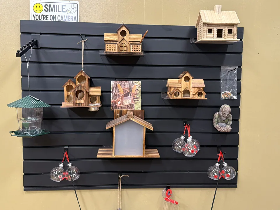 Birdhouses, feeders, and lifestyle items on display