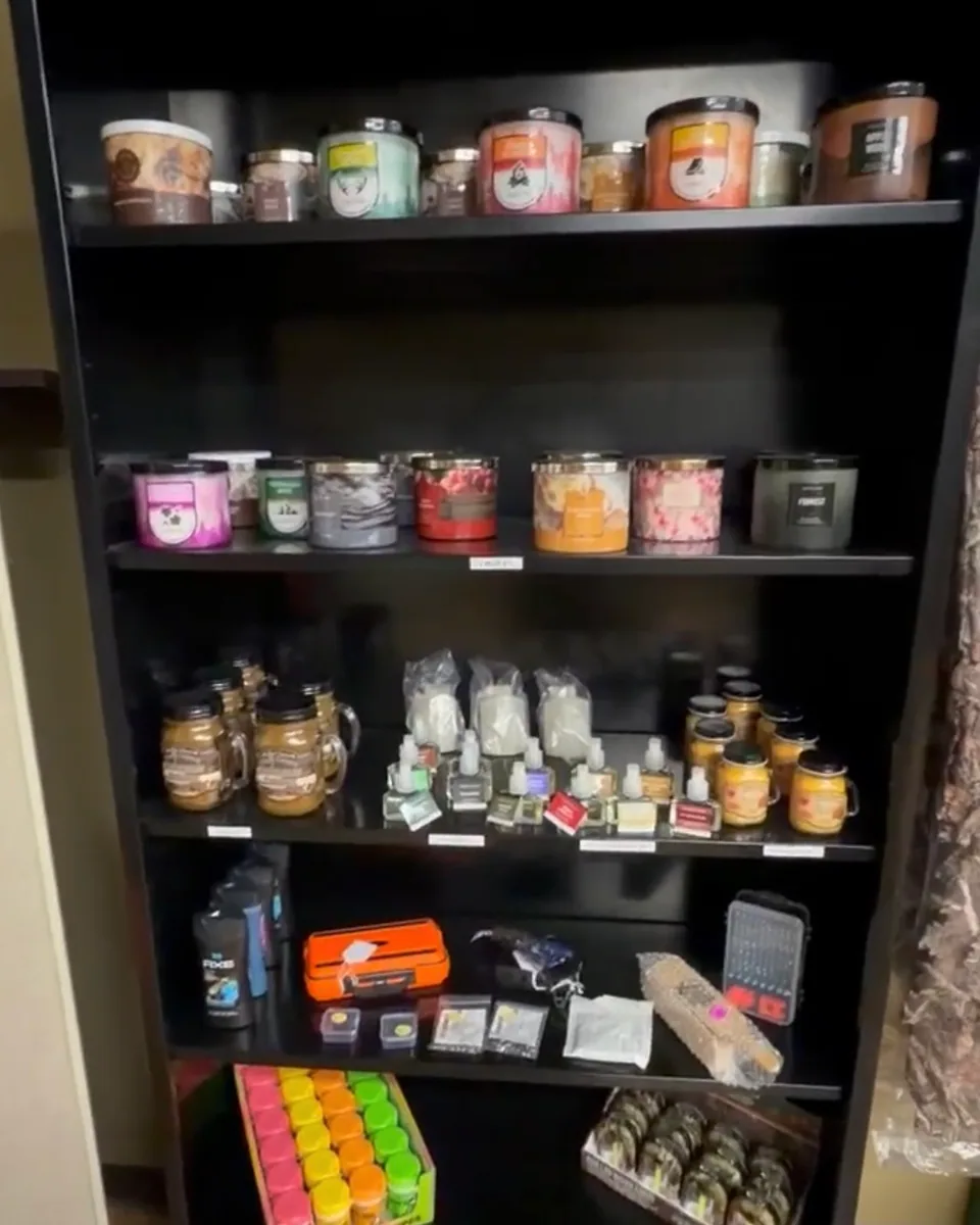 Shelves of scented candles and home goods inside the store